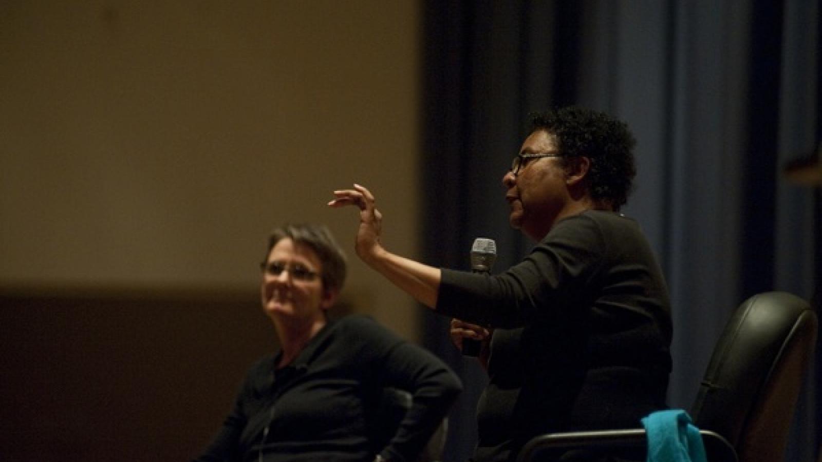 Shannon Winnubst and bell hooks from the side of the stage